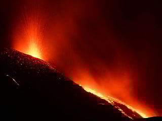 Italy's Mount Etna lights up night sky in stunning eruption