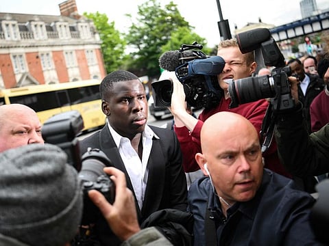 West Ham's French defender Kurt Zouma arrives at the Thames Magistrates' Court, in London, to attend his sentencing for kicking and slapping his cat in a video posted on the social network Snapchat.