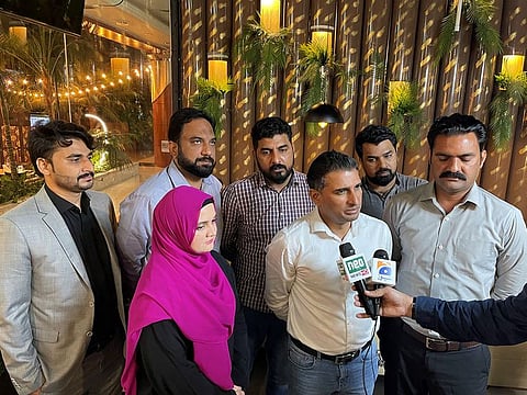 Mian Owais Anjum, PTI president in Dubai (second from right), talking to media at a reception in Dubai.