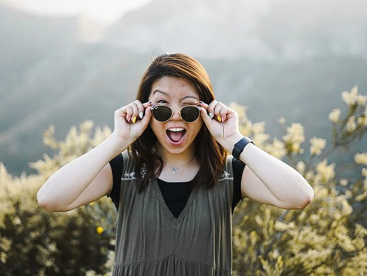 Playfulness benefits for adults winking smiling 
