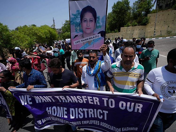 Employees of Jammu and Kashmir Teachers Association shout slogans during a protest against the killing of colleague Rajini Bala in Jammu, on June 2, 2022.  