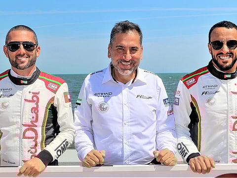 Team Abu Dhabi's Thani Al Qemzi and Shaun Torrente with team manager Guido Cappellini, a 10-time F1H2O champion.