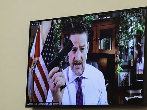 Rep. Greg Steube demonstrates assembling his handgun as he speaks remotely during a House Judiciary Committee mark up hearing in the Rayburn House Office Building on June 02, 2022 in Washington, DC.