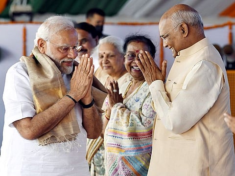 President Ram Nath Kovind and Prime Minister Narendra Modi attend the public function, at Paraunkh village, in Kanpur on Friday, June 3, 2022. First Lady Savita Kovind is also seen.