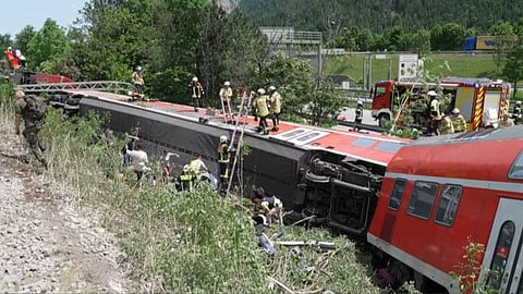 This video grab taken from footage of Network Pictures on June 3, 2022 shows rescue services at the site of a derailed train near Burgrain, southern Germany.