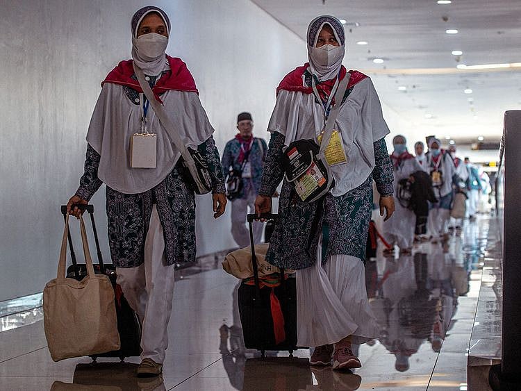 Indonesian pilgrims prepare to depart from Juanda International Airport in Surabaya, for Mecca in Saudi Arabia to perform Hajj. 
