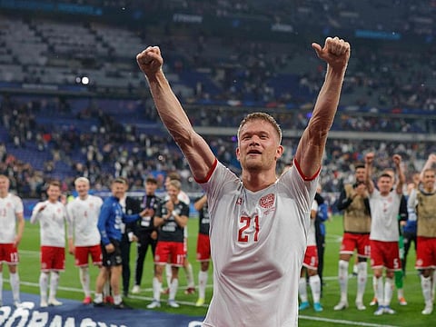 Denmark’s forward Andreas Cornelius celebrates with teammates after winning the UEFA Nations League match against France.
