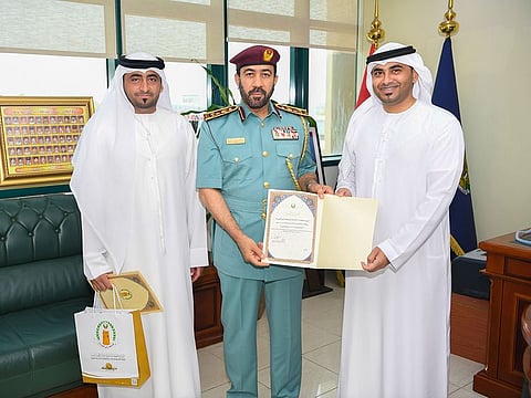 Brigadier General Abdullah Khamis Al Hadidi presented Nader Ali Kassin and Abdullah Ali Kassin with a certificate and a reward