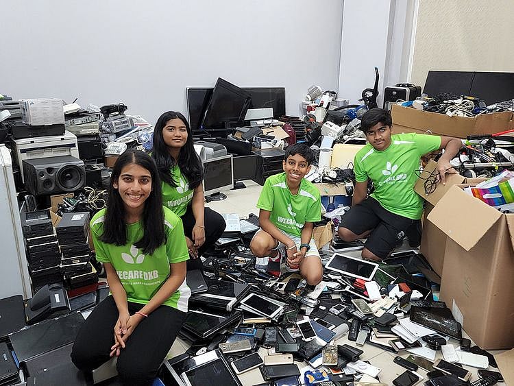 Riva-Tulpule-(L)-with-WeCareDXB-team-and-the-e-waste-1654339287902