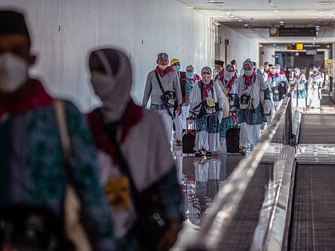 Indonesian pilgrims prepare to depart from Juanda International Airport in Surabaya on June 4, 2022.