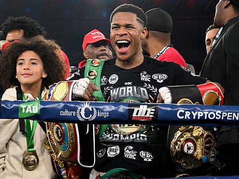 Devin Haney of the US celebrates after defeating Australia's George Kambosos in the lightweight unification title boxing bout to become the undisputed lightweight champion of the world in Melbourne.