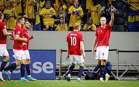Norway's Erling Braut Haaland celebrates scoring their second goal with teammates.