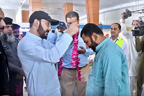 Provincial Minister for Housing Syed Ali Haider Gillani seeing off the pilgrims departing for Hajj on the first flight from Multan International Airport. APP photo by Tanveer Bukhari