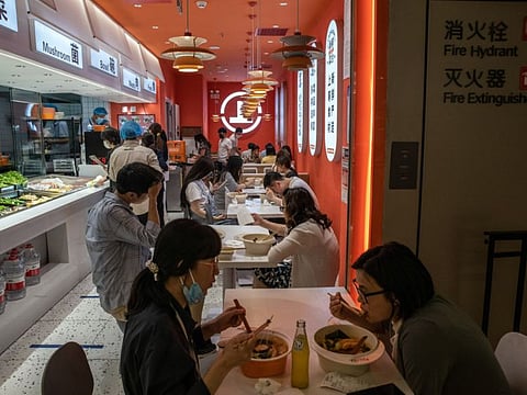Customers dine inside a restaurant in Beijing, on June 7, 2022.  