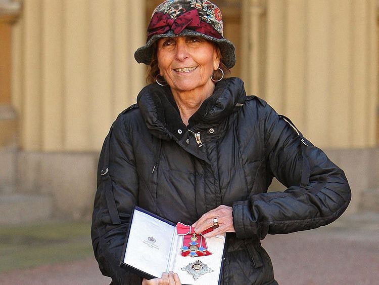 In this file photo taken on October 20, 2010 Portuguese artist Paula Rego poses with her DBE (Dame Commander of the Order of the British Empire), after she was awarded it by Britain's Queen Elizabeth II, during an Investiture ceremony at Buckingham Palace in London.  