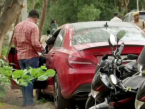 Forensic team collects evidence from the car used in the alleged sexual assault of a 17-year-old girl last week, at Jubilee Hills Police Station, in Hyderabad.