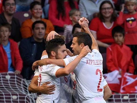 Spain's forward Pablo Sarabia (left) celebrates after scoring during the UEFA Nations League League A Group 2 match against Switzerland at the Stade de Geneve in Geneva.