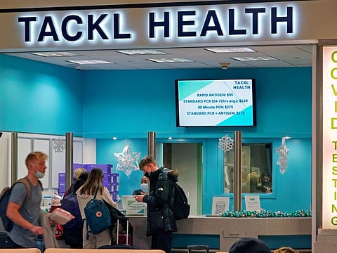 Travellers wait for COVID testing at Pittsburgh International Airport in Imperial, Pa., on Dec. 27, 2021.