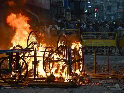 Overturned handcarts are in flames following a protest against former Bharatiya Janata Party spokeswoman Nupur Sharma and her remarks, in Ranchi on June 10, 2022.  