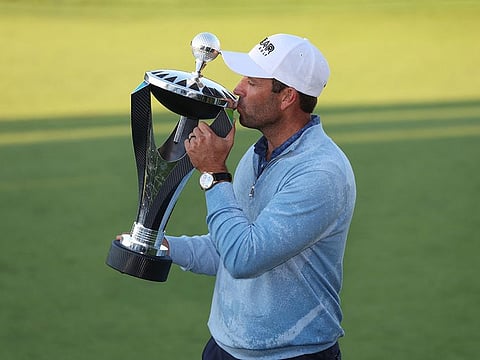 South Africa's Charl Schwartzel of the Stinger team celebrates with the trophy after winning the inaugural LIV Golf Invitational in England last month.