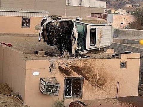 The car sits on the rooftop in the aftermath. 