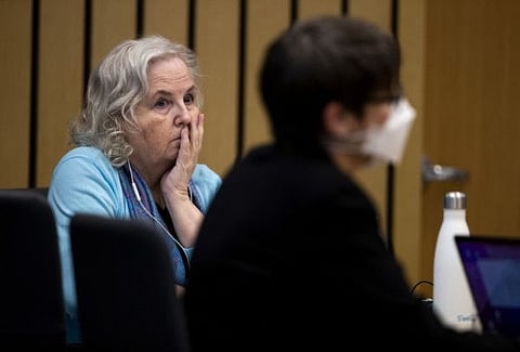 Romance writer Nancy Crampton Brophy, left, accused of killing her husband, Dan Brophy, in June 2018, watches proceedings in court in Portland, on April 4, 2022. 