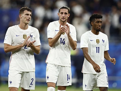France's players applaud their fans after the match against Croatia. 