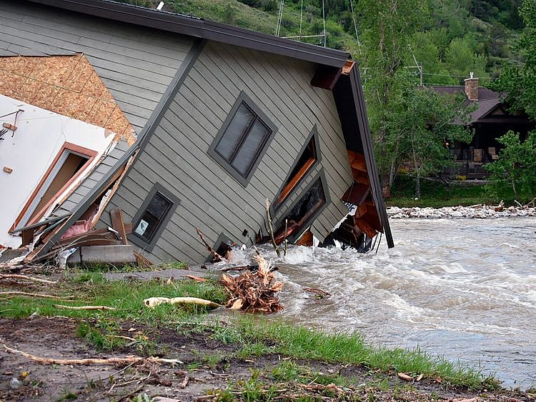 A house that was pulled into Rock Creek in Red Lodge, Montana, by raging floodwaters on June 14, 2022.  