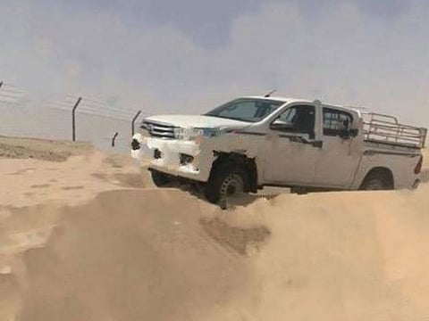 The man's pick-up truck got stuck in the sand and after several failed attempts to get it out, he gave up after getting exhausted as a result of the high temperature.