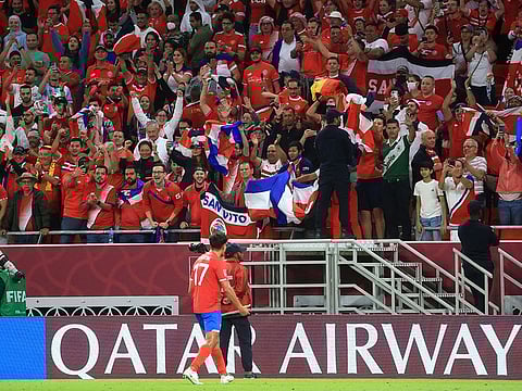 Costa Rica's Yeltsin Tejeda celebrates with fans after qualifying for the Qatar 2022 FIFA World Cup.