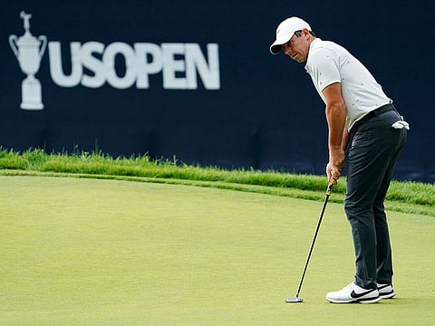 Rory McIlroy putts on the 18th green during a practice round of the US Open at The Country Club.
