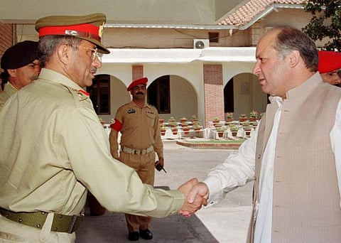 Pakistan army chief General Pervez Musharraf (left) greets Prime Minister Nawaz Sharif at army headquarters in Rawalpindi in the file picture from June 1999.