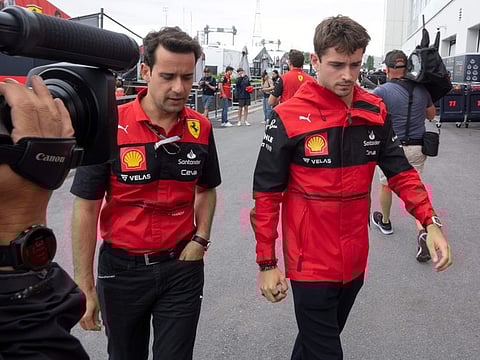 Ferrari driver Charles Leclerc (right) walks through the paddock of the Gilles Villeneuve Circuit ahead of the Canadian Grand Prix on Thursday.