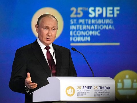 Russian President Vladimir Putin gestures as he addresses a plenary session of the St. Petersburg International Economic Forum in St. Petersburg, Russia, Friday, June 17, 2022.