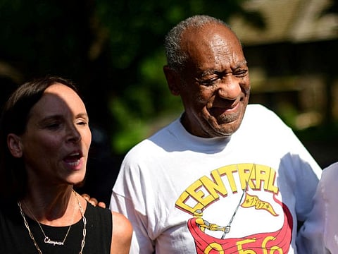 FILE PHOTO: Bill Cosby stands next to lawyer Jennifer Bonjean outside his home after Pennsylvania's highest court overturned his sexual assault conviction and ordered him released from prison immediately, in Elkins Park, Pennsylvania, U.S., June 30, 2021.  REUTERS/Mark Makela/File Photo