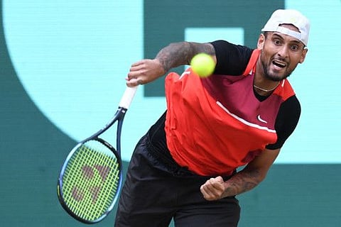 Australia's Nick Kyrgios returns the ball to Spain's Pablo Carreno Busta during the men's singles quarter final match at the ATP 500 Halle Open tennis tournament in Halle, western Germany.