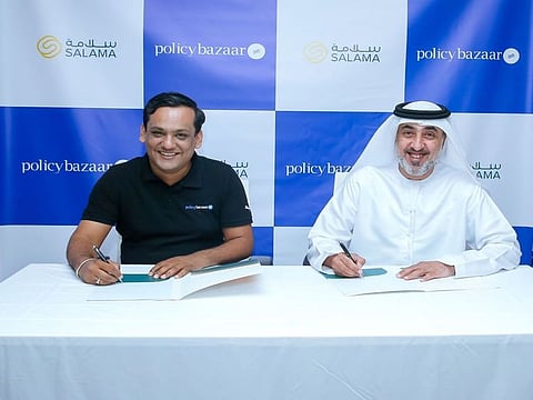Neeraj Gupta, CEO, Policybazaar.ae and Fahim Al Shehhi, CEO, Salama sign the agreement