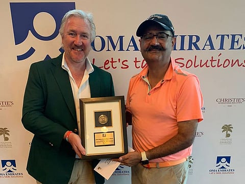 Vishal Tikku, winner of the recent OMA Emirates DG Medal supported by Christies International Real Estates, Dubai, with Men's Emirates Golf Club Captain, Campbell Steadman.