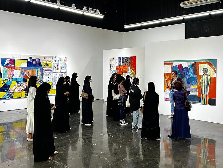 Students-viewing-NFTs-hosted-by-Zawyeh-Gallery-at-Al-Serkal-Avenue-as-part-of-Abu-Dhabi-Art-Art-+-Tech-programme-by-MORROW-collective.-Photos-courtesy-of-MORROW-collective.-1655907114890