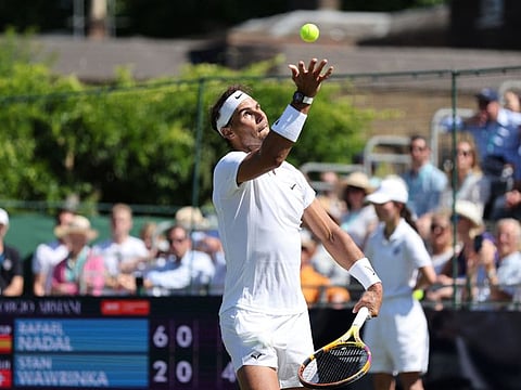 Spain's Rafael Nadal serves the ball to Switzerland's Stanislas Wawrinka during their men's exhibition singles match at The Giorgio Armani Tennis Classic tournament at the Hurlingham Club in London on Thursday.