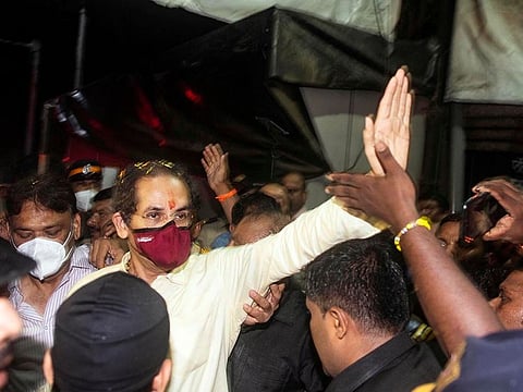 Maharashtra Chief Minister and Shiv Sena chief Uddhav Thackeray waves to the party supporters on his arrival at his residence 'Matoshree', Bandra, in Mumbai.  