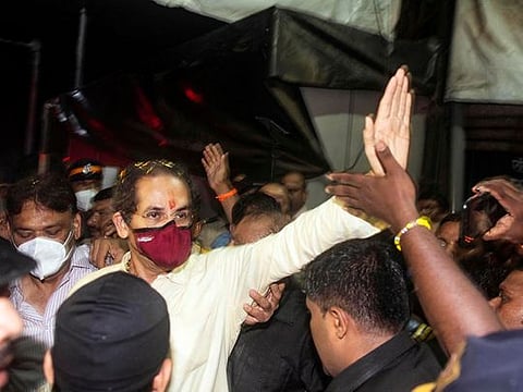Maharashtra Chief Minister and Shiv Sena chief Uddhav Thackeray waves to the party supporters on his arrival at his residence 'Matoshree', Bandra, in Mumbai.  