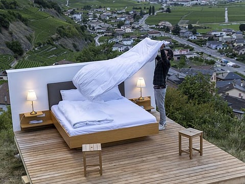 Swiss artist Patrik Riklin, co-founder of the Null-Stern-Hotel (Zero-Star-Hotel) offering guests a choice between four open-air rooms in reaction to the world current state after the pandemic, prepares the Bayart suite in Saillon, Switzerland June 15, 2022.