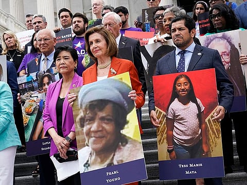 House Speaker Nancy Pelosi of Calif., and other lawmakers, talk about the gun violence bill at the Capitol in Washington, Friday, June 24, 2022. At left is Rep. Judy Chu, D-Calif., and at right is Rep. Jimmy Gomez, D-Calif.