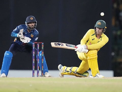 Australia's Alex Carey plays a sweep as Kusal Mendis watches during the fifth One Day International against Sri Lanka in Colombo on Friday.