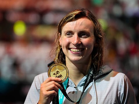 Gold medalist Katie Ledecky of the United States poses with her medal after the Women 800m Freestyle final at the 19th FINA World Championships in Budapest, Hungary.
