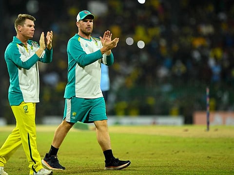 Australia's captain Aaron Finch (right) cheers Sri Lankan cricket fans after the final one-day international match at the R. Premadasa International Cricket Stadium in Colombo.