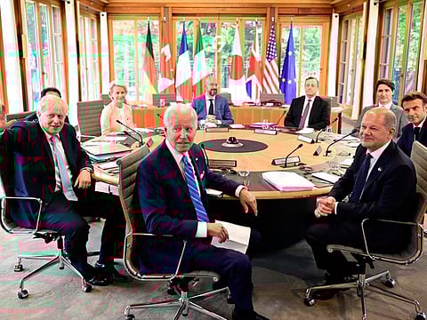 Clockwise from left: Fumio Kishida (covered), Prime Minister of Japan, Ursula von der Leyen, President of the European Commission, Charles Michel, President of the European Council, Mario Draghi, Prime Minister of Italy, Justin Trudeau, Prime Minister of Canada, Emmanuel Macron, Prime Minister of France, German Chancellor Olaf Scholz, US President Joe Biden and Boris Johnson, Prime Minister of the United Kingdom sit at the first working session in Castle Elmau in Kruen, near Garmisch-Partenkirchen, Germany, on June 26, 2022. 