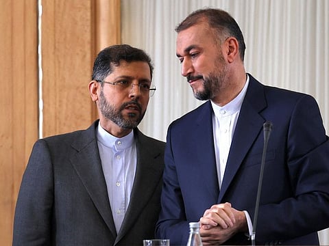 Iran's Foreign Minister Hossein Amir-Abdollahian (right) speaks with his ministry spokesman Saeed Khatibzadeh in a file photo.
