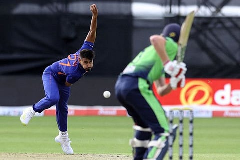 Indian pacer Umran Malik (left) bowls during the Twenty20 International against Ireland at Malahide Cricket Club in Dublin on Sunday.